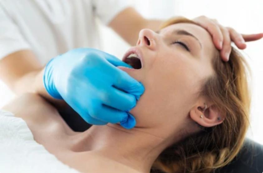 Manual therapy treatment session showing hands-on therapeutic techniques